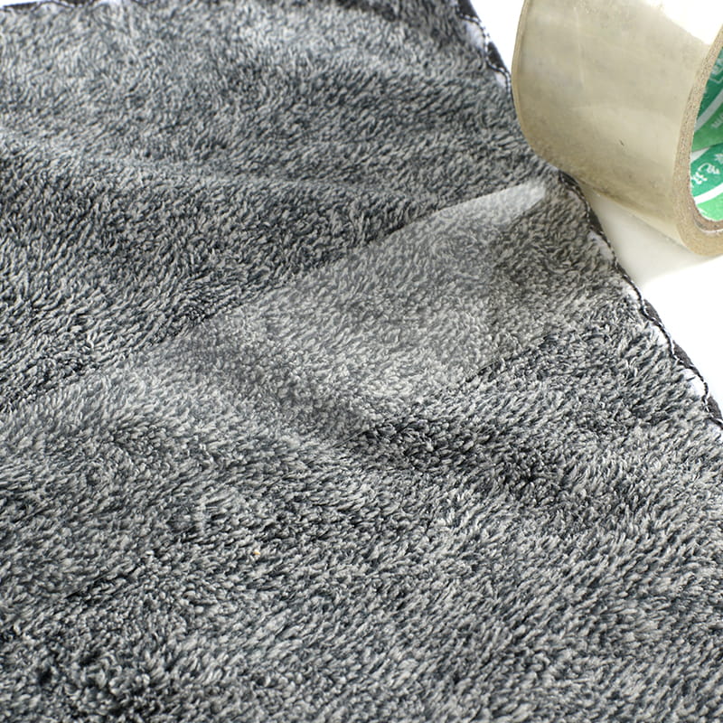 How do microfiber towels help reduce the need for chemical cleaning products in the home?